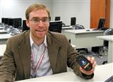 Sean Moss-Pultz, president of OpenMoko with a Neo 1973 handset