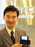 HTC CMO John Wang with a T-Mobile G1 handset