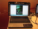 A Dell notebook that features Quanta's Optical Touch Screen