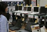 Consumer picking a netbook