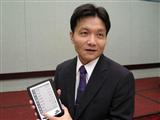 Gemtek chairman Howard Chen showcases an e-book reader
