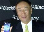 Foxconn chairman Terry Gou with a BlackBerry Z3