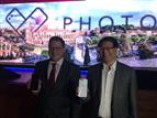 Asustek CEO Jerry Shen poses with Qualcomm executive vice president Christiano Amon in Roman