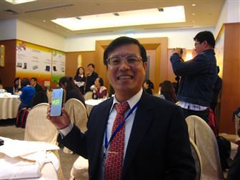 Peter Chen, Aiptek chairman, holding a PocketCinema V10