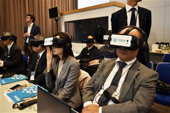 Visitors watch VR video about Taiwan-made machine tools at JIMTOF