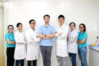 Johnny Chang (center), a director of board for Vietnam-based Dai-Y Clinic