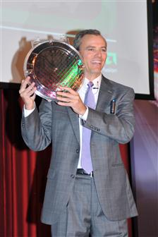 Chris Cloran, corporate vice president and general manager, client division, AMD, holding Llano wafer